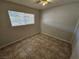Well-lit bedroom, featuring tile floors and a window with blinds at 2208 W Washington Ave, Las Vegas, NV 89106