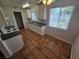 Bright kitchen with white cabinets, tiled floor, and stainless steel appliances at 2208 W Washington Ave, Las Vegas, NV 89106