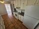 Bright kitchen with white cabinets, tiled floor, and stainless steel appliances at 2208 W Washington Ave, Las Vegas, NV 89106