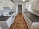 Bright kitchen with white cabinets, tiled floor, and stainless steel appliances at 2208 W Washington Ave, Las Vegas, NV 89106
