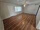 Spacious living room with wood-look floors and ceiling fan at 2208 W Washington Ave, Las Vegas, NV 89106