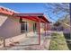 Covered patio with concrete flooring, access to backyard at 2613 Nobility Ave, North Las Vegas, NV 89032