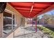 Covered patio, view of backyard and storage shed at 2613 Nobility Ave, North Las Vegas, NV 89032