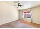 Primary bedroom with ceiling fan and neutral carpet at 2613 Nobility Ave, North Las Vegas, NV 89032