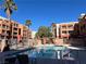 Inviting community pool with lounge chairs at 27 E Agate Ave # 208, Las Vegas, NV 89123