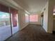 Dining room with carpet flooring and access to balcony at 27 E Agate Ave # 208, Las Vegas, NV 89123