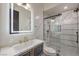 Modern bathroom with a large mirror and a walk-in shower at 282 E Maulding Ave, Las Vegas, NV 89123