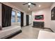 Bedroom with twin bed, TV, and plenty of natural light at 282 E Maulding Ave, Las Vegas, NV 89123