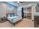 Spacious bedroom with a queen-size bed and balcony access at 282 E Maulding Ave, Las Vegas, NV 89123