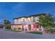 Two-story home with modern facade and landscape lighting at 282 E Maulding Ave, Las Vegas, NV 89123