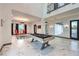 Spacious game room featuring a pool table and high ceilings at 282 E Maulding Ave, Las Vegas, NV 89123
