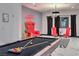 Game room with billiard table, red velvet chairs, and unique wall decor at 282 E Maulding Ave, Las Vegas, NV 89123