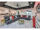Open living space with sectional sofa, marble floors, and kitchen views at 282 E Maulding Ave, Las Vegas, NV 89123
