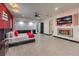 Spacious main bedroom with a fireplace, large TV, and red accent wall at 282 E Maulding Ave, Las Vegas, NV 89123
