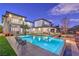 Inviting backyard oasis with a large pool, spa, and fire pit at 282 E Maulding Ave, Las Vegas, NV 89123