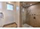 Walk-in shower with stone tile and multiple shower heads at 282 E Maulding Ave, Las Vegas, NV 89123