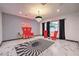 Stylish sitting area with red velvet chairs and a captivating rug at 282 E Maulding Ave, Las Vegas, NV 89123