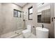 Modern bathroom with a glass shower, toilet and floating sink at 2824 Queens Courtyard Dr, Las Vegas, NV 89109