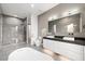 Elegant bathroom featuring double vanity, soaking tub, and shower at 2824 Queens Courtyard Dr, Las Vegas, NV 89109