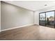 Bright bedroom with hardwood floors and access to a balcony at 2824 Queens Courtyard Dr, Las Vegas, NV 89109