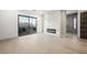 Modern bedroom with fireplace, balcony, and hardwood floors at 2824 Queens Courtyard Dr, Las Vegas, NV 89109