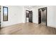 Light and airy bedroom with wood floors and en-suite bathroom at 2824 Queens Courtyard Dr, Las Vegas, NV 89109