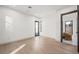 Spacious bedroom with light wood floors and door to another room at 2824 Queens Courtyard Dr, Las Vegas, NV 89109