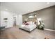Bright bedroom with light wood floors and a large bed at 2824 Queens Courtyard Dr, Las Vegas, NV 89109