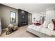 Modern bedroom with fireplace and large windows at 2824 Queens Courtyard Dr, Las Vegas, NV 89109