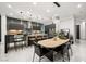 Modern dining room features a light wood table and stylish chairs at 2824 Queens Courtyard Dr, Las Vegas, NV 89109