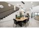Elegant dining room with a modern wood table and black chairs at 2824 Queens Courtyard Dr, Las Vegas, NV 89109