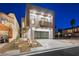 Modern two-story home with sleek design and a gated driveway at 2824 Queens Courtyard Dr, Las Vegas, NV 89109
