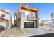Modern two-story home with attached garage and landscaped front yard at 2824 Queens Courtyard Dr, Las Vegas, NV 89109