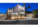 Contemporary home with a modern facade and landscaped yard at 2824 Queens Courtyard Dr, Las Vegas, NV 89109