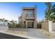 Modern two-story home with attached garage and sleek design at 2824 Queens Courtyard Dr, Las Vegas, NV 89109