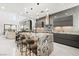 Modern kitchen with island seating and high-end finishes at 2824 Queens Courtyard Dr, Las Vegas, NV 89109