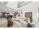 Open living area with curved sectional sofa and high ceilings at 2824 Queens Courtyard Dr, Las Vegas, NV 89109