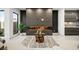 Living room with modern fireplace and views into kitchen at 2824 Queens Courtyard Dr, Las Vegas, NV 89109