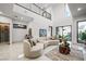 Open living area with curved sectional and high ceilings at 2824 Queens Courtyard Dr, Las Vegas, NV 89109
