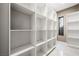 Bright and spacious pantry with ample shelving for storage at 2824 Queens Courtyard Dr, Las Vegas, NV 89109