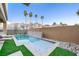 Relaxing pool and spa area with artificial turf and modern feel at 2824 Queens Courtyard Dr, Las Vegas, NV 89109