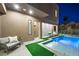 Relaxing backyard with a modern pool and comfortable seating area at 2824 Queens Courtyard Dr, Las Vegas, NV 89109