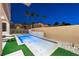 Private backyard oasis with a modern pool and lounge chairs at 2824 Queens Courtyard Dr, Las Vegas, NV 89109