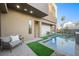 Modern pool and patio with lounge chairs and artificial turf at 2824 Queens Courtyard Dr, Las Vegas, NV 89109