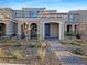 Two-story home with attractive landscaping and a paved walkway at 3206 Brynley Ave, Henderson, NV 89044