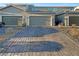 Two-car garage with paved driveway and landscaping at 3206 Brynley Ave, Henderson, NV 89044