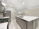 Modern kitchen with large island and stainless steel appliances at 3206 Brynley Ave, Henderson, NV 89044