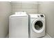 Bright laundry room with washer and dryer at 3206 Brynley Ave, Henderson, NV 89044
