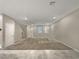 Bright and airy living room with neutral carpeting and tile flooring at 3206 Brynley Ave, Henderson, NV 89044