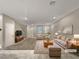 Spacious living room with tiled floors and neutral color palette at 3206 Brynley Ave, Henderson, NV 89044
